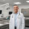Internal medicine physician in white coat smiling